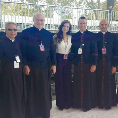 Margaret pictured with the Vatican officials and envoys before performing for Pope Francis' visit to the USA